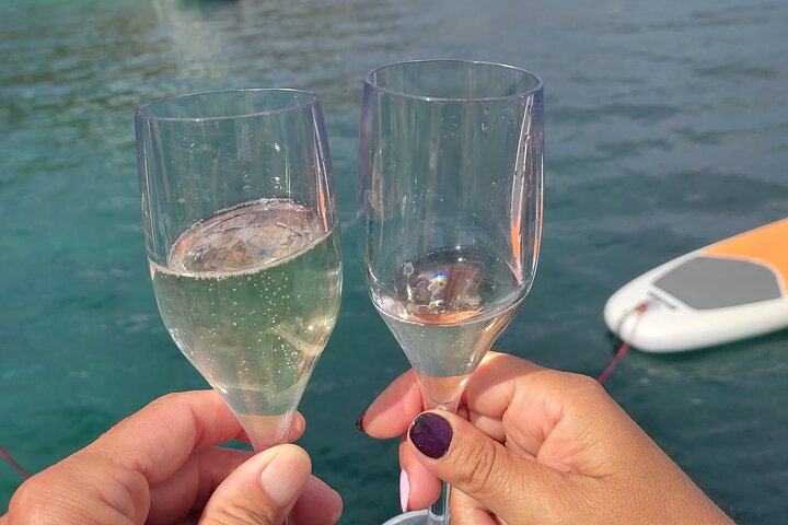 Sunset aperitif on a sailing boat in Alghero, Alghero